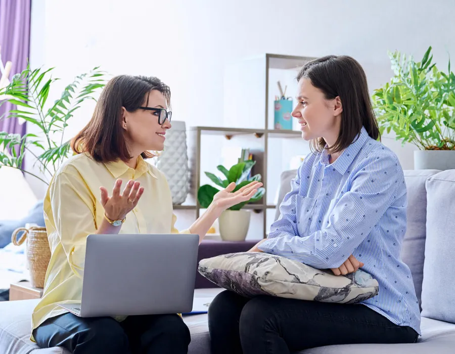 Psychologist with Laptop Speaking with Patient