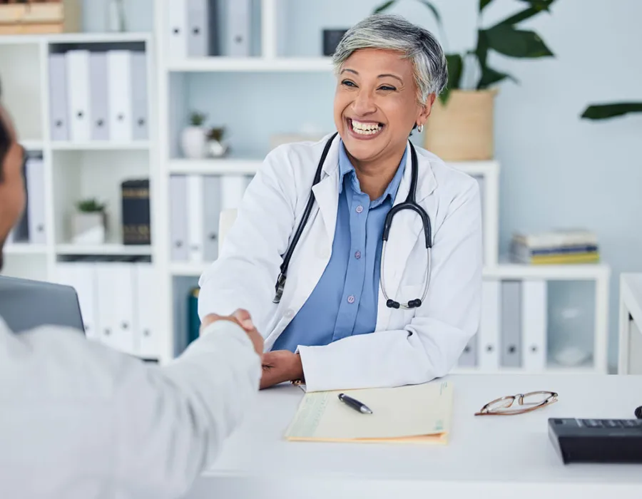 Public Health Nurse Shaking Hands with Nurse Manager