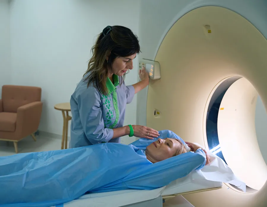 Rad tech guiding patient through X-ray procedure