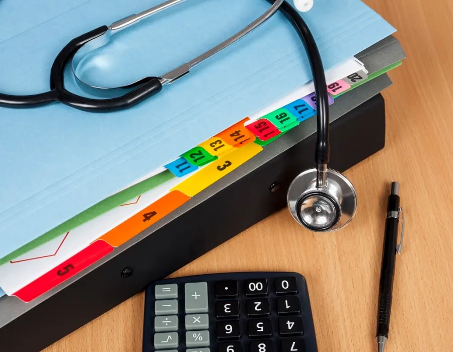 File folder on desk with stethoscope resting on top