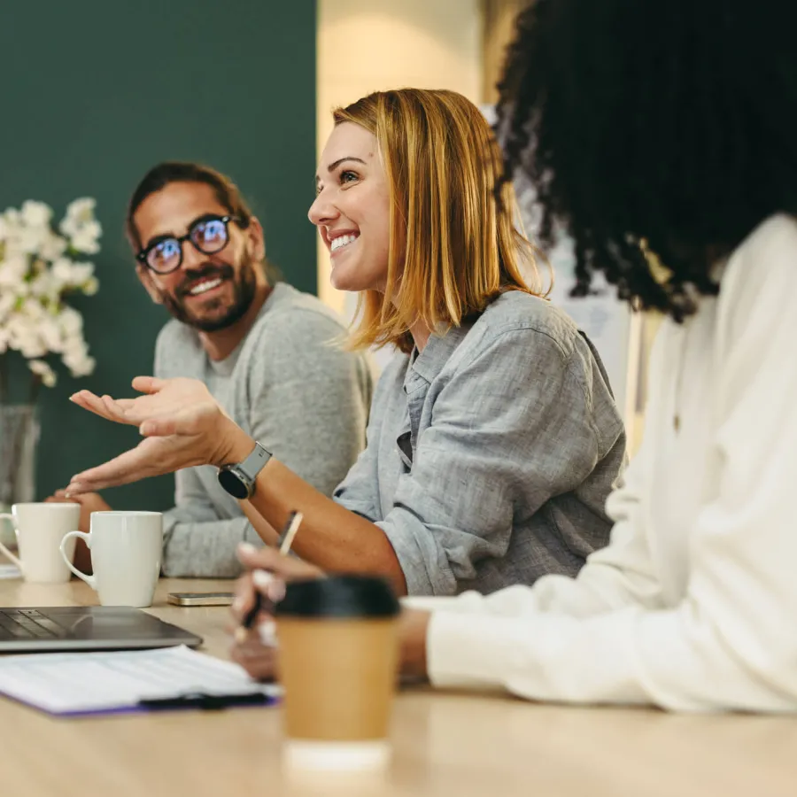 Young business managers and contributors participate in team meeting