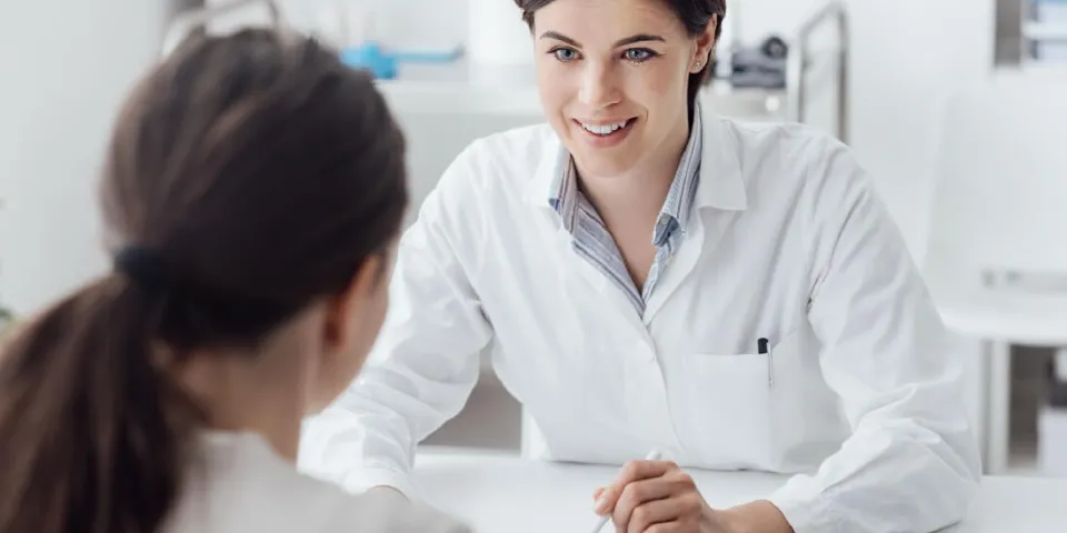 Nurse Practitioner with DNP Speaking with Patient