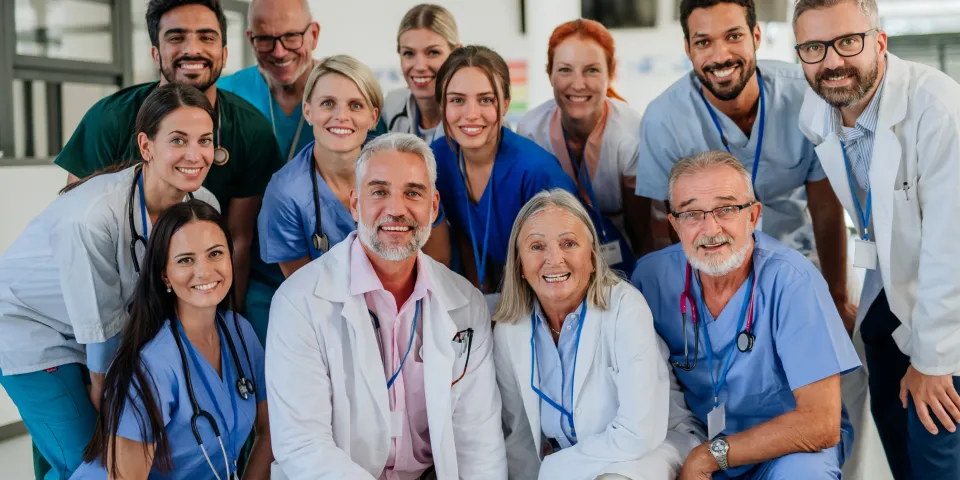 Portrait of happy doctors, nurses and other medical staff in a hospital.